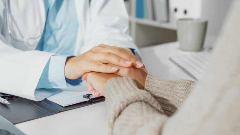 Doctor supporting a cancer patient, symbolizing positive lifestyle changes after diagnosis.